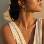 Geometric hammered hoop earring macro beauty shot
