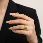 Model in black suit wearing Meshy ring with long nails