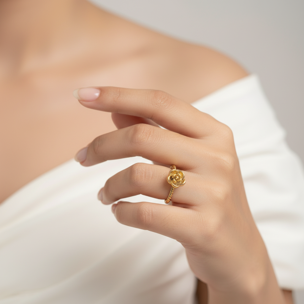 Model in white off-shoulder dress wearing rose ring